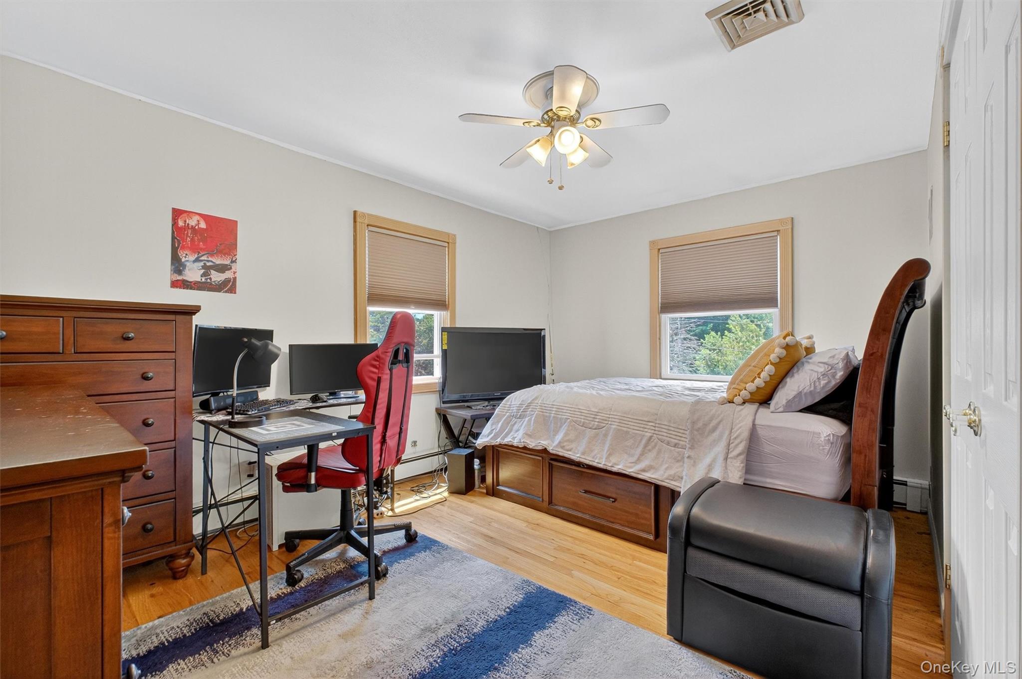 5 Verplanck Avenue Hopewell Junction, NY 12533 - Photo 28 of 50 a bedroom with furniture and a wooden floor