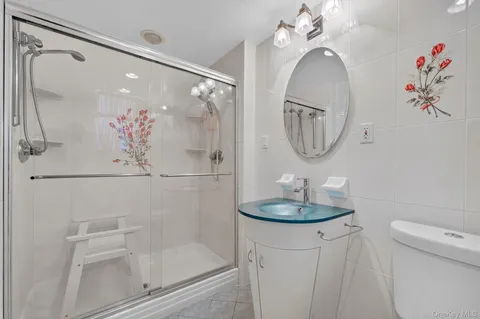 a bathroom with a mirror a sink and a mirror