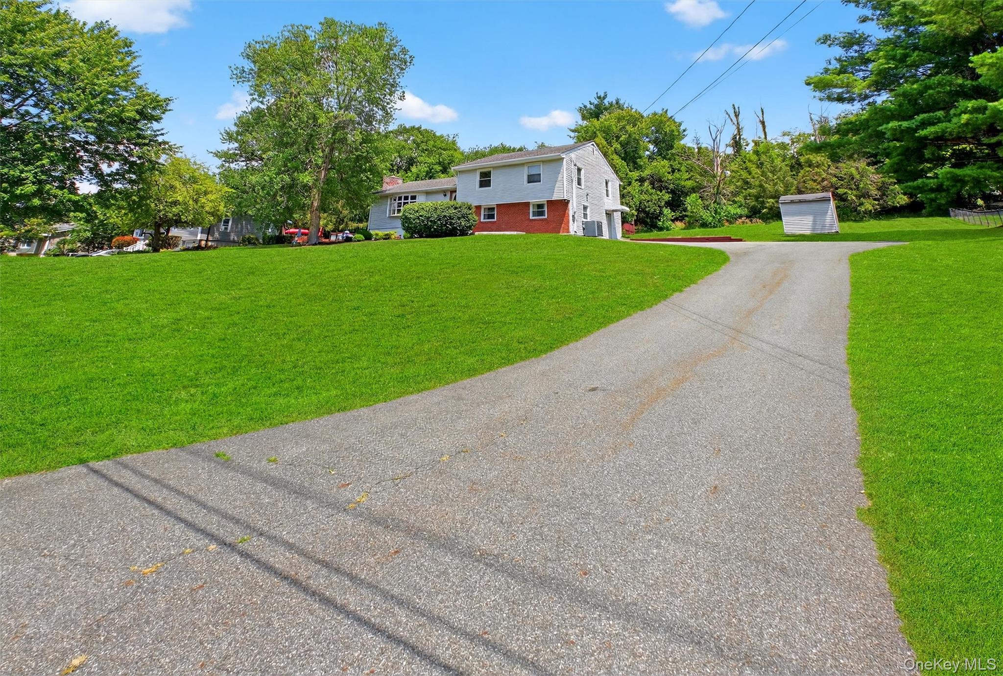 5 Verplanck Avenue Hopewell Junction, NY 12533 - Photo 3 of 50 a view of a park with a house in the background
