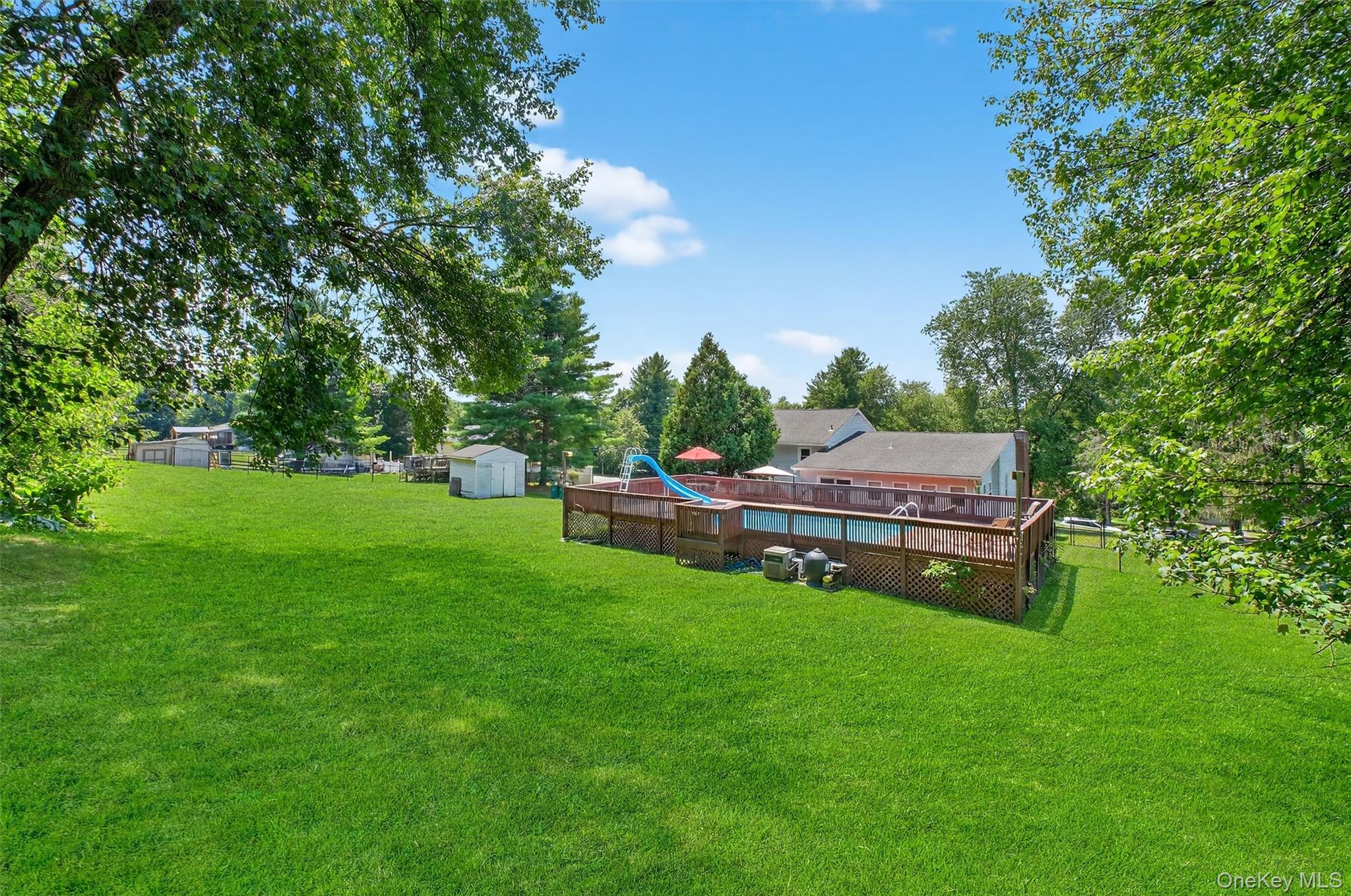 5 Verplanck Avenue Hopewell Junction, NY 12533 - Photo 44 of 50 a backyard of a house with table and chairs