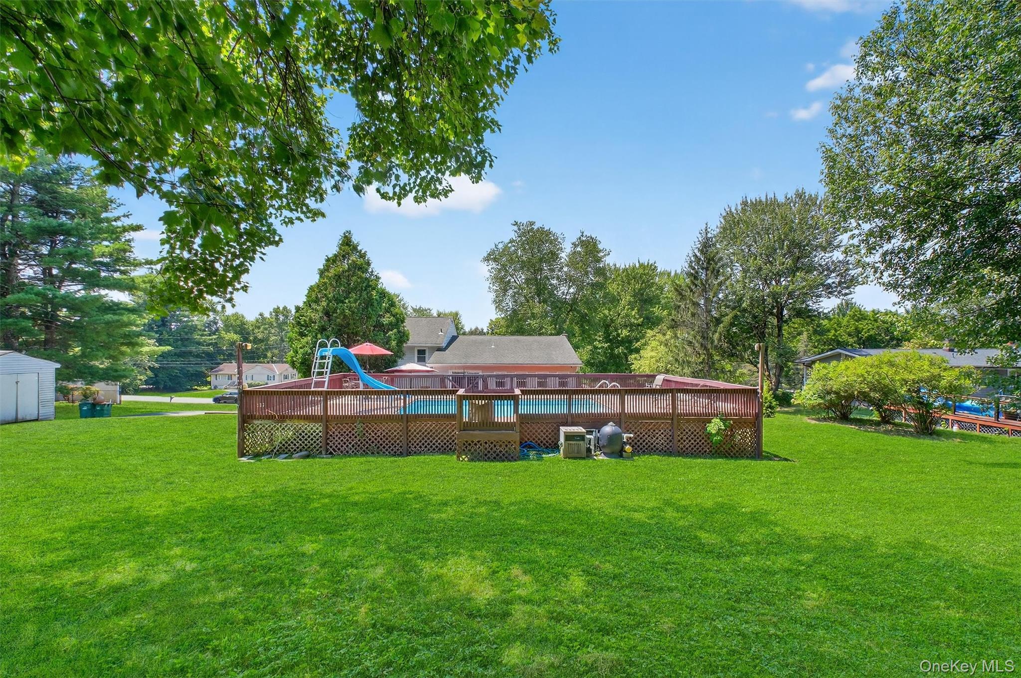 5 Verplanck Avenue Hopewell Junction, NY 12533 - Photo 45 of 50 a backyard of a house with table and chairs