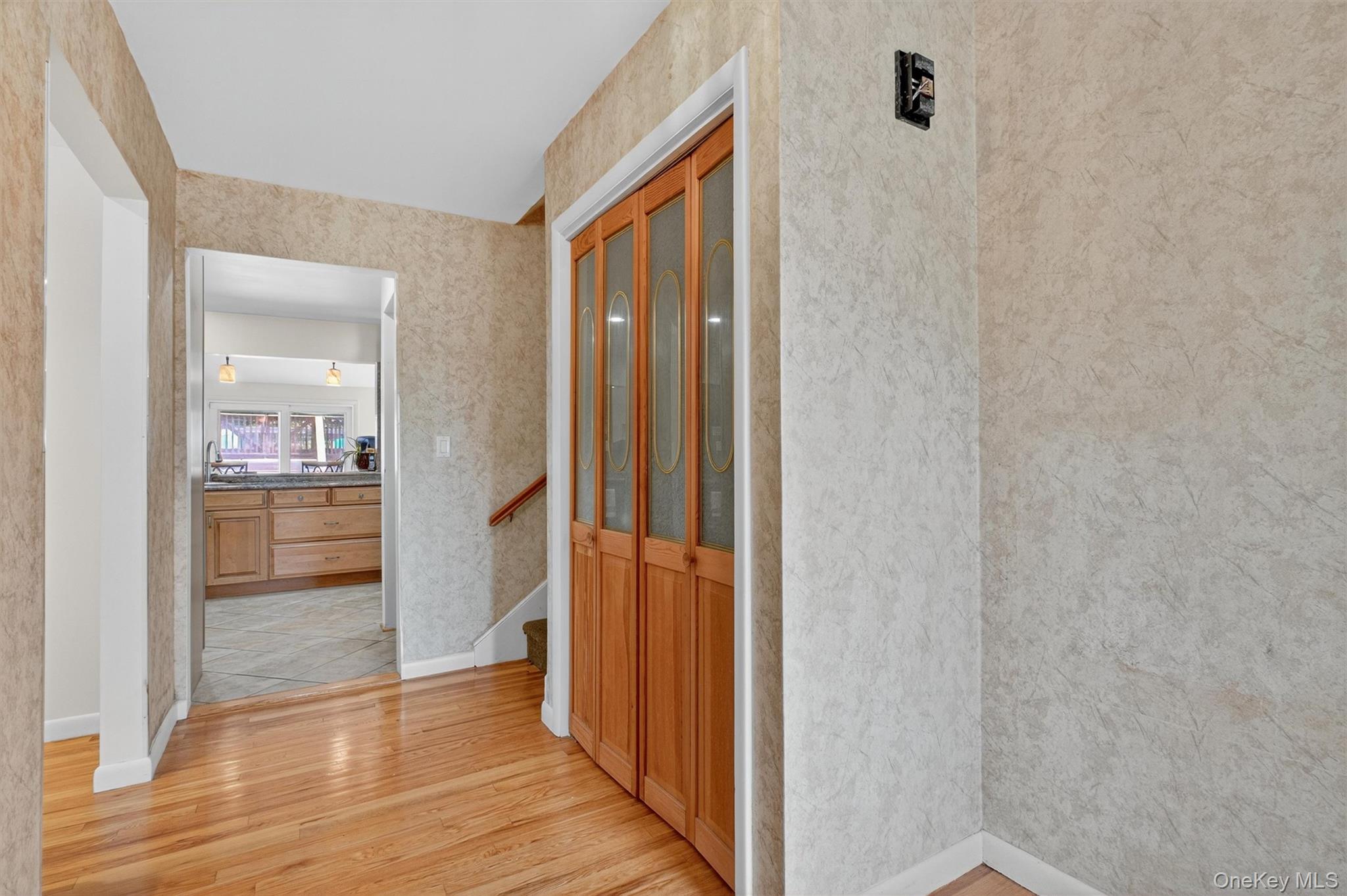 5 Verplanck Avenue Hopewell Junction, NY 12533 - Photo 5 of 50 a view of a hallway with wooden floor and a bathroom