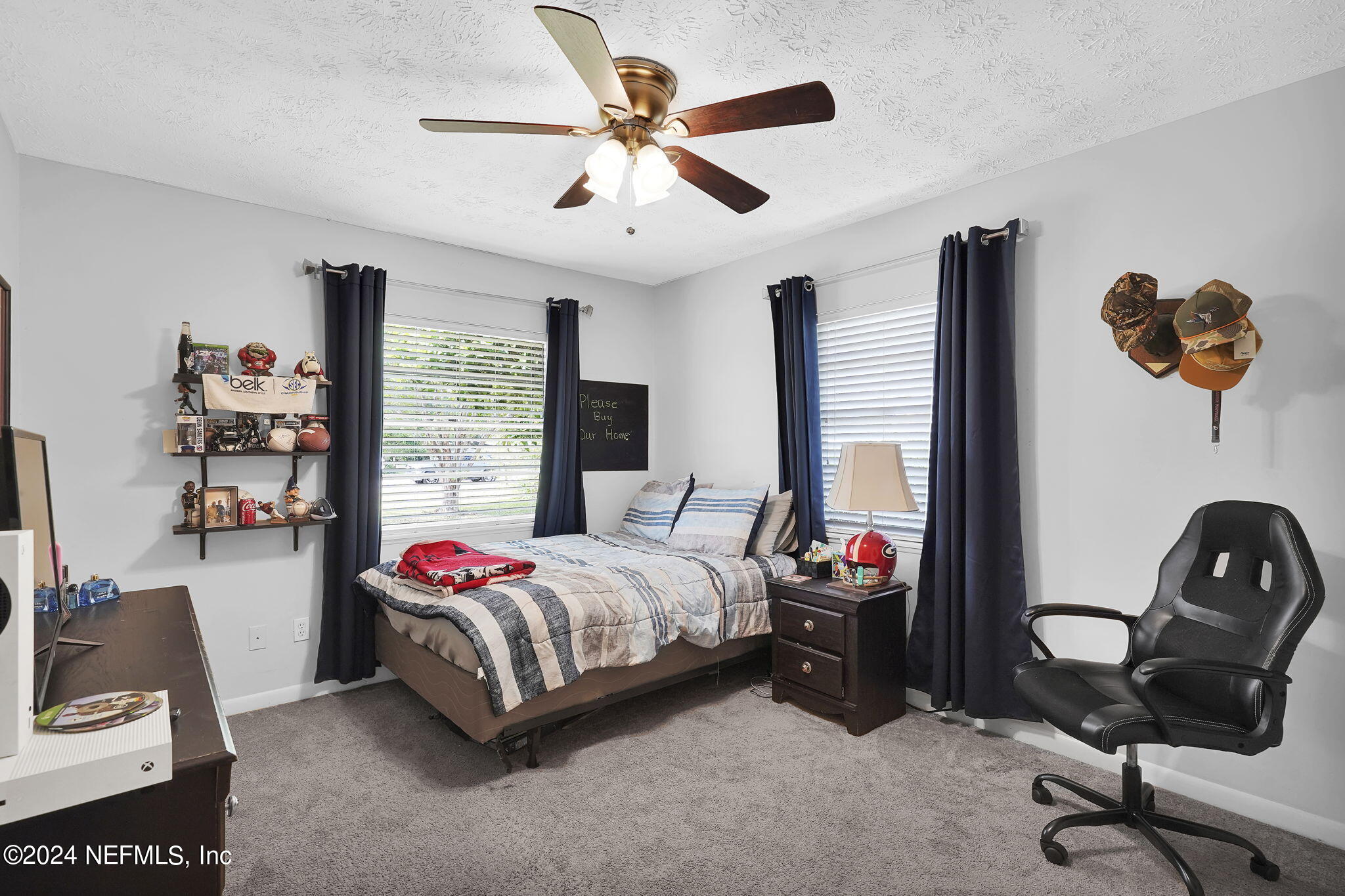 54371 Hazel Jones Road Callahan, FL 32011 - Photo 22 of 36 a bedroom with a bed and a window