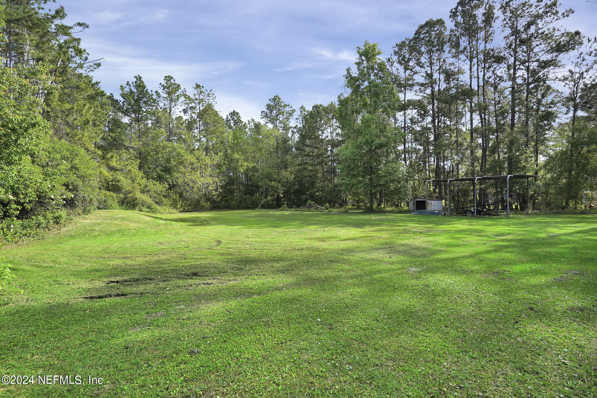 54371 Hazel Jones Road Callahan, FL 32011 - Photo 29 of 36 a view of a field of grass and trees