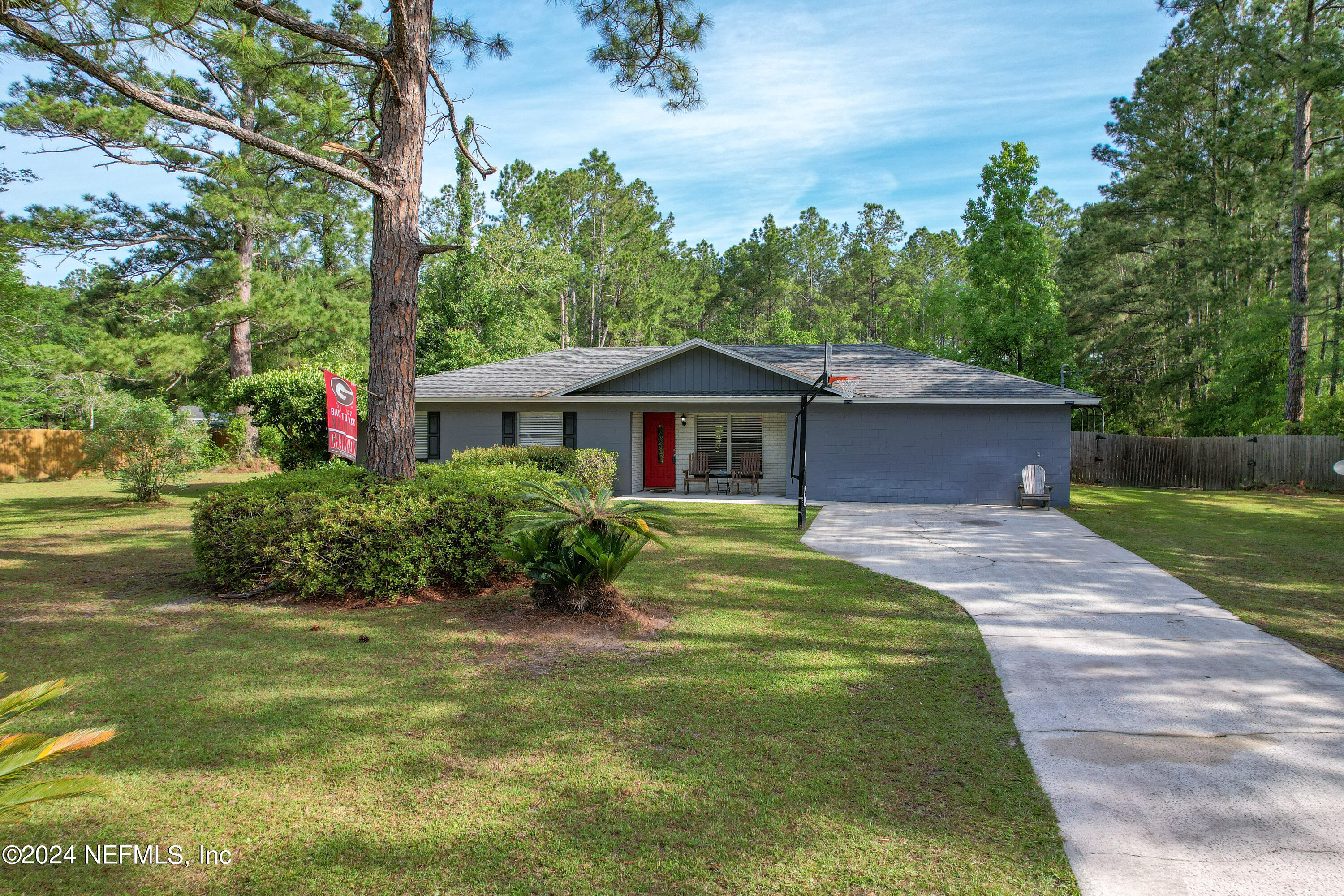 54371 Hazel Jones Road Callahan, FL 32011 - Photo 3 of 36 a front view of a house with a yard