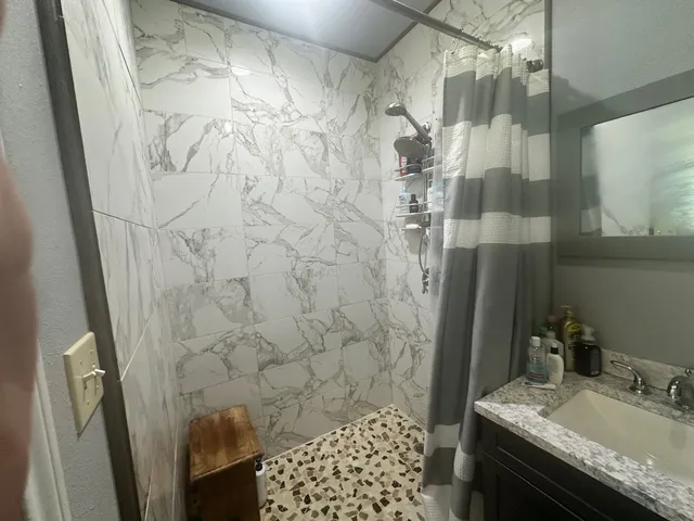 a bathroom with a sink and a mirror