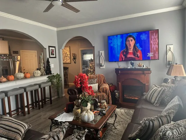 a living room with furniture and a fireplace