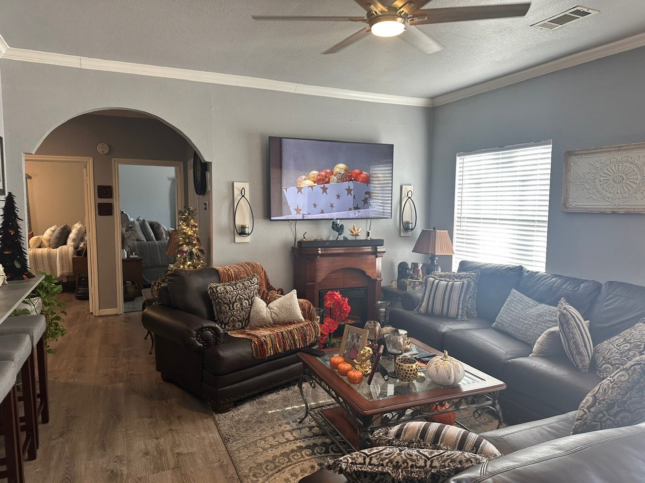 109 Foreman Trinity, TX 75862 - Photo 5 of 17 a living room with furniture a fireplace and a flat screen tv