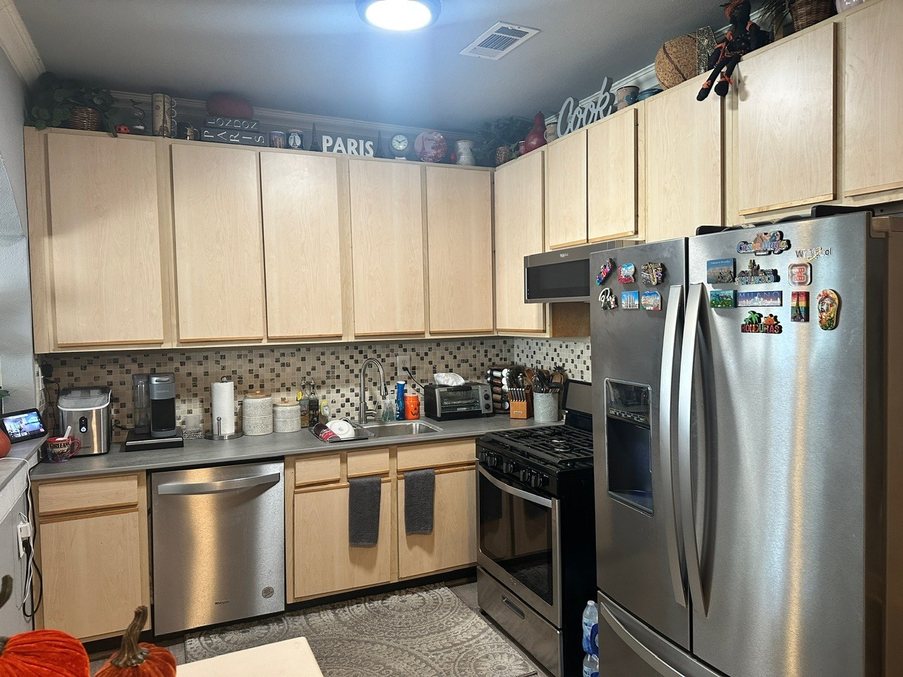 109 Foreman Trinity, TX 75862 - Photo 8 of 17 a kitchen with stainless steel appliances a refrigerator sink and white cabinets
