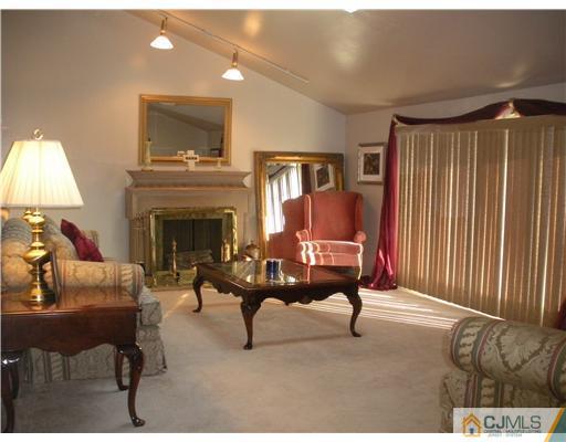 36 Brookside Road Edison, NJ 08817 - Photo 2 of 19 a living room with furniture and a fireplace