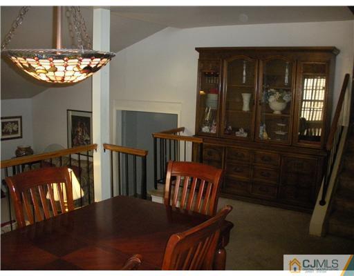 36 Brookside Road Edison, NJ 08817 - Photo 4 of 19 a view of a dining room with furniture window and wooden floor