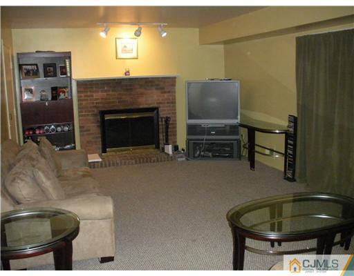 36 Brookside Road Edison, NJ 08817 - Photo 7 of 19 a living room with furniture and a fireplace