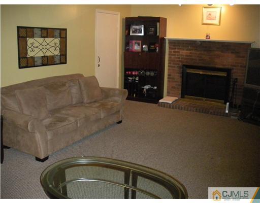 36 Brookside Road Edison, NJ 08817 - Photo 9 of 19 a living room with furniture and a fireplace