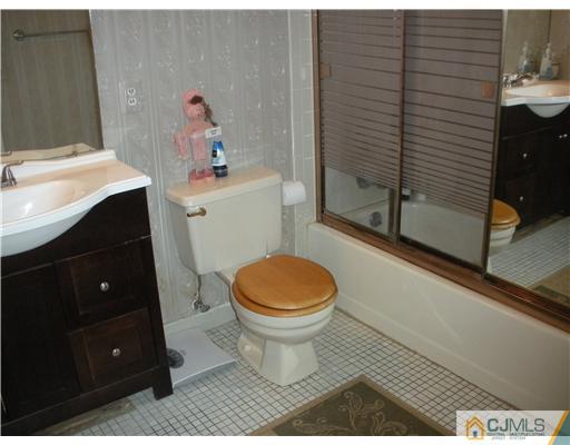 36 Brookside Road Edison, NJ 08817 - Photo 10 of 19 a bathroom with a sink toilet and shower