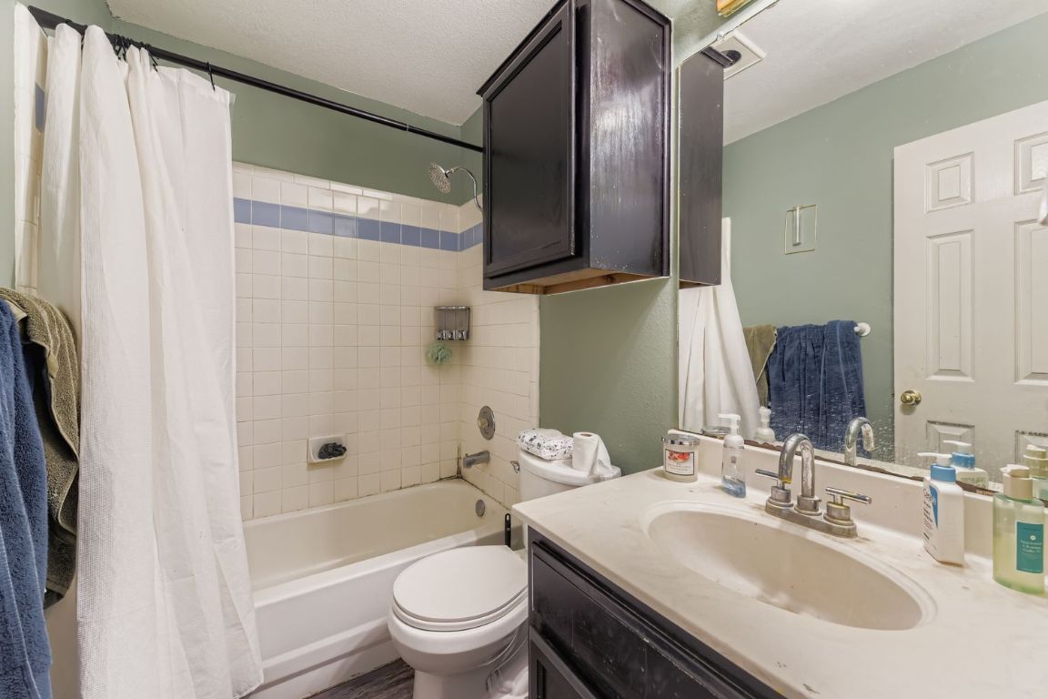 4705 Fallenash Drive Austin, TX 78725 - Photo 9 of 11 Full bathroom with shower / tub combo and vanity
