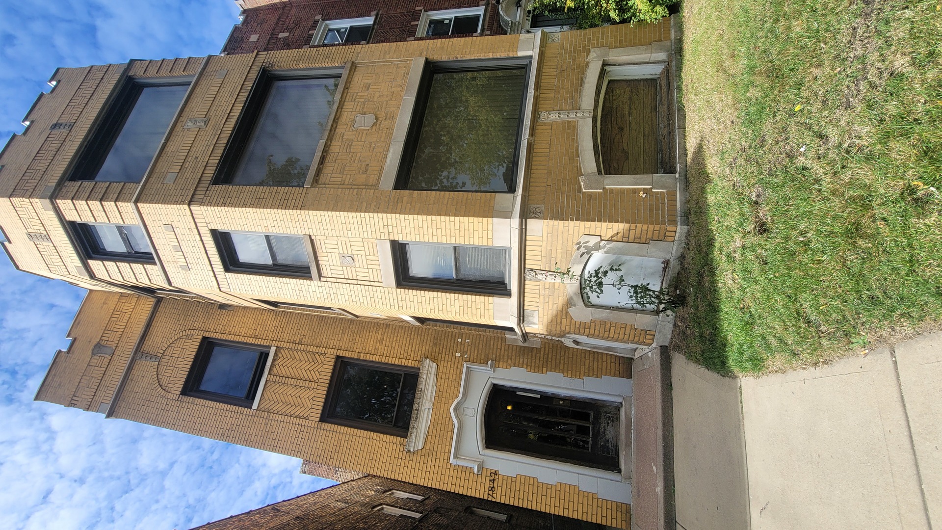 7842 South Bennett Avenue, Unit 2 Chicago, IL 60649 - Photo 2 of 10 a view of living room with a fireplace and wooden floor