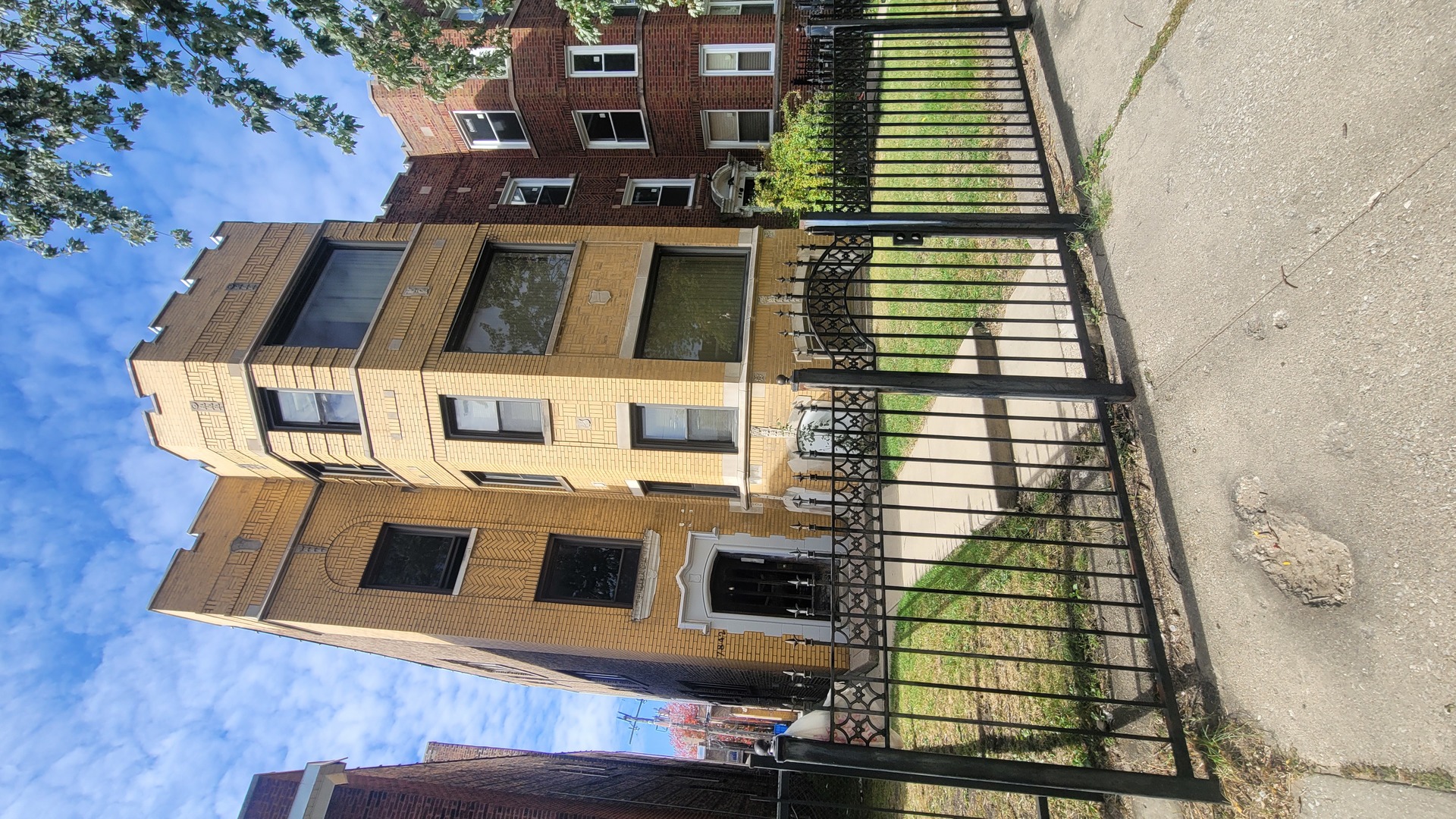 7842 South Bennett Avenue, Unit 2 Chicago, IL 60649 - Photo 10 of 10 a front view of a multi story building