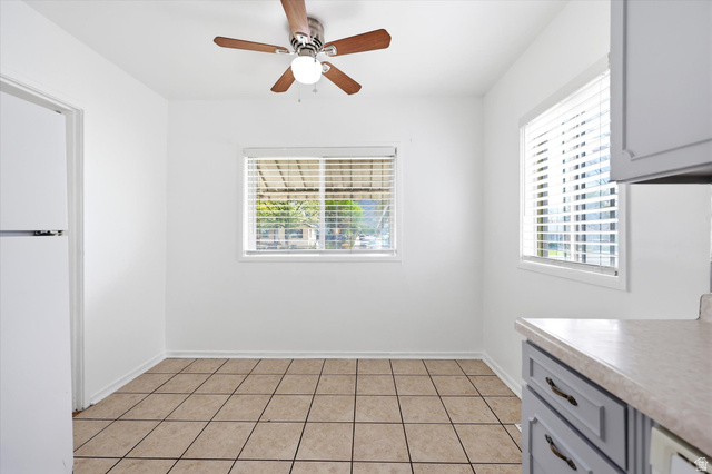 676 South 500 West Provo, UT 84601 - Photo 11 of 29 Unfurnished dining area featuring ceiling fan and light tile patterned floors