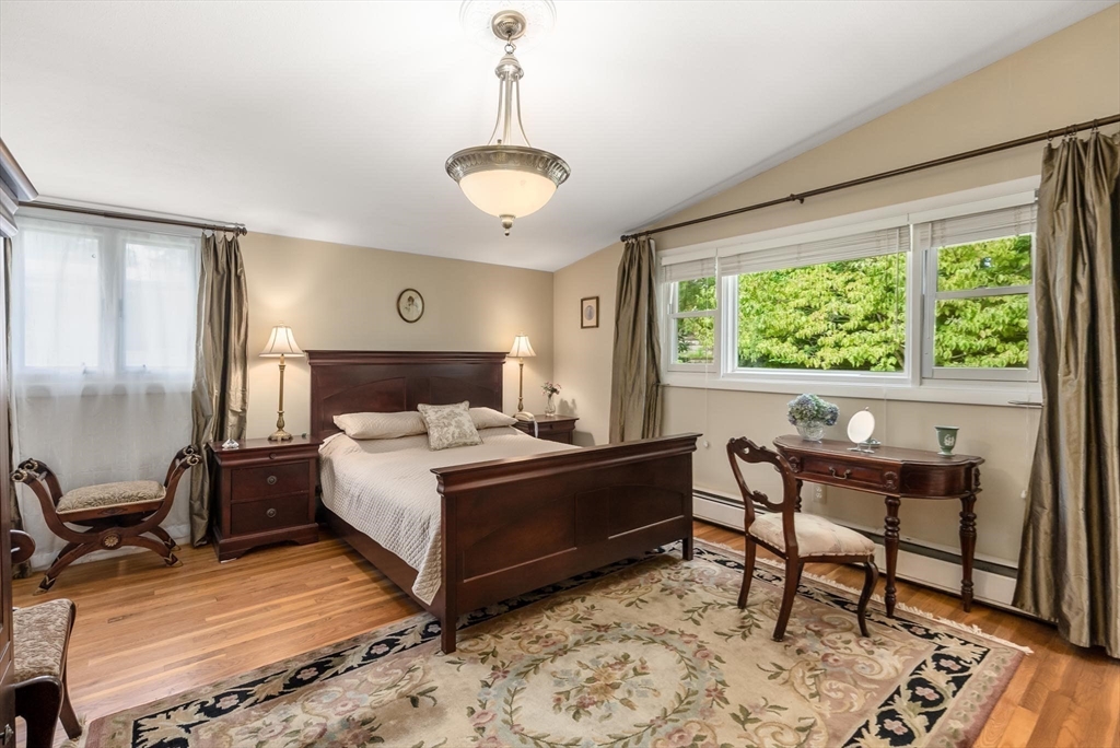 54 Clark Street Newton, MA 02459 - Photo 18 of 34 a bed room with a bed and a chair