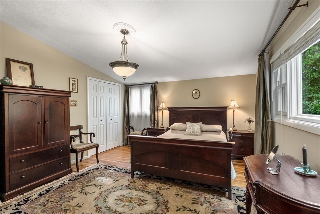 54 Clark Street Newton, MA 02459 - Photo 19 of 34 a bedroom with a bed and wooden floor