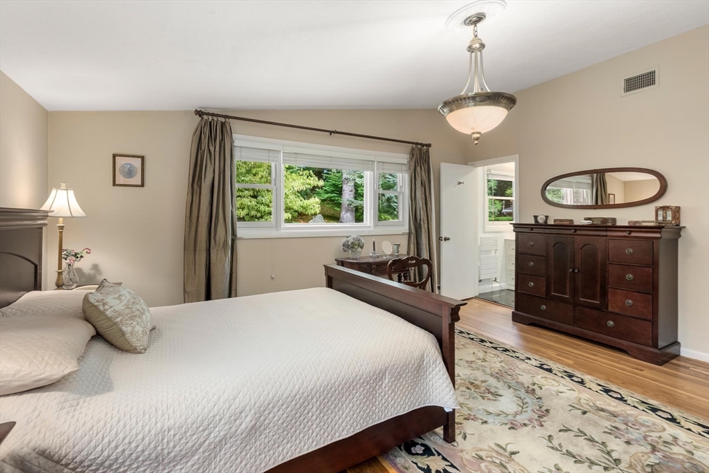 54 Clark Street Newton, MA 02459 - Photo 20 of 34 a bedroom with a bed a fireplace and a window