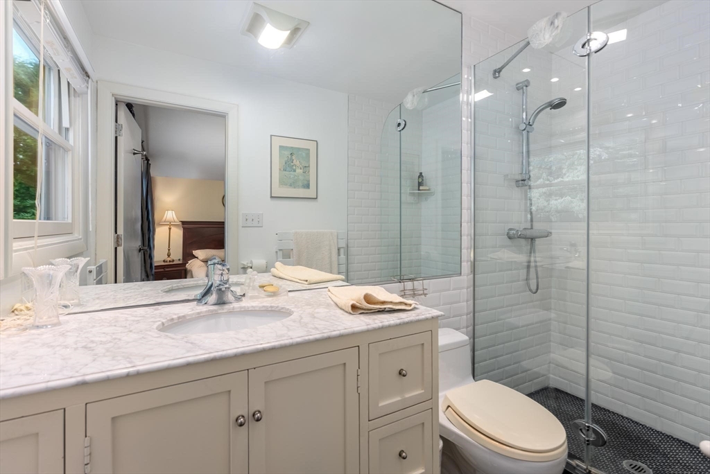 54 Clark Street Newton, MA 02459 - Photo 21 of 34 a bathroom with a sink a toilet and shower