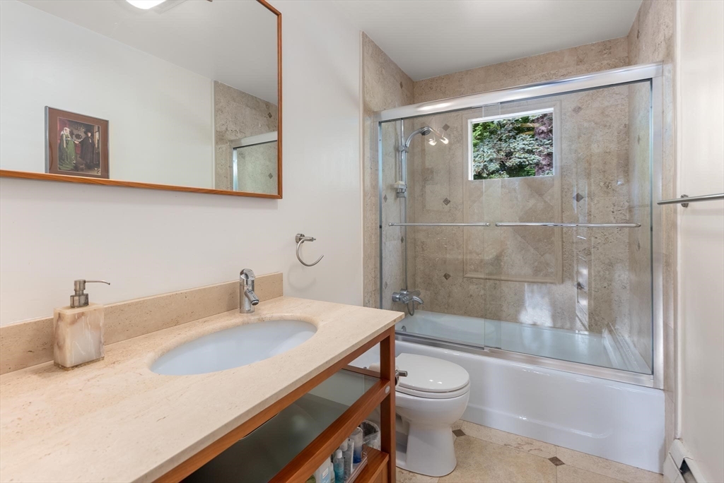 54 Clark Street Newton, MA 02459 - Photo 23 of 34 a bathroom with a sink toilet and shower
