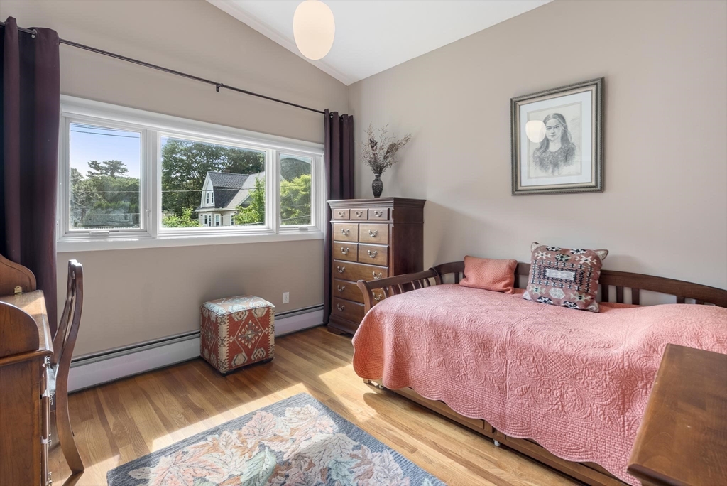 54 Clark Street Newton, MA 02459 - Photo 24 of 34 a bedroom with a bed and wooden floor