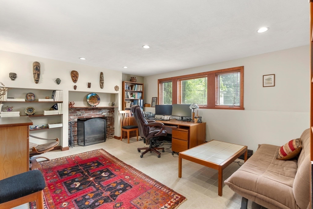 54 Clark Street Newton, MA 02459 - Photo 25 of 34 a living room with furniture a rug and a window