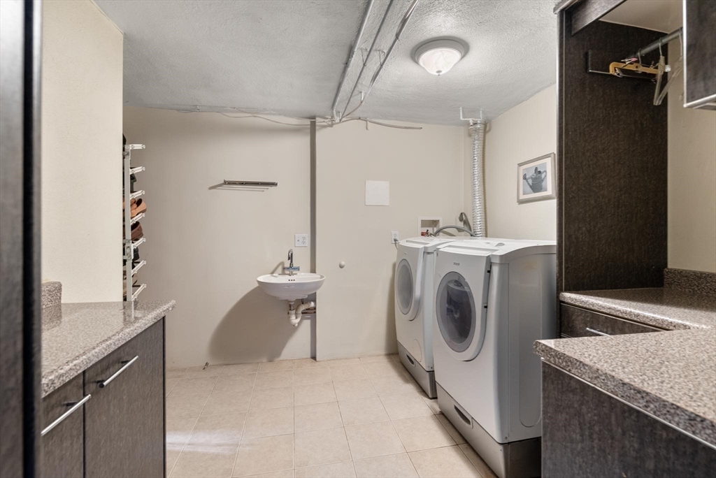 54 Clark Street Newton, MA 02459 - Photo 27 of 34 a utility room with dryer and washer