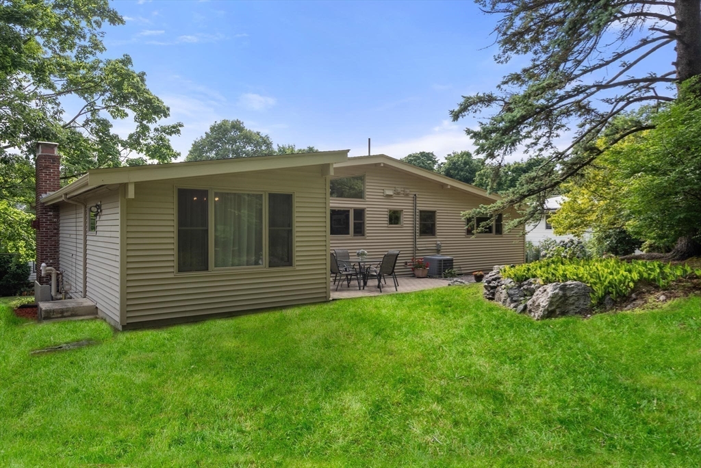 54 Clark Street Newton, MA 02459 - Photo 29 of 34 a front view of a house with a garden