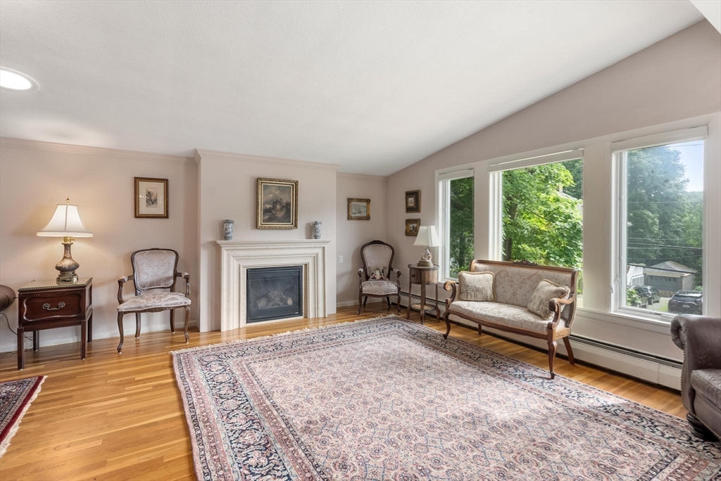 54 Clark Street Newton, MA 02459 - Photo 4 of 34 a living room with furniture fireplace and window
