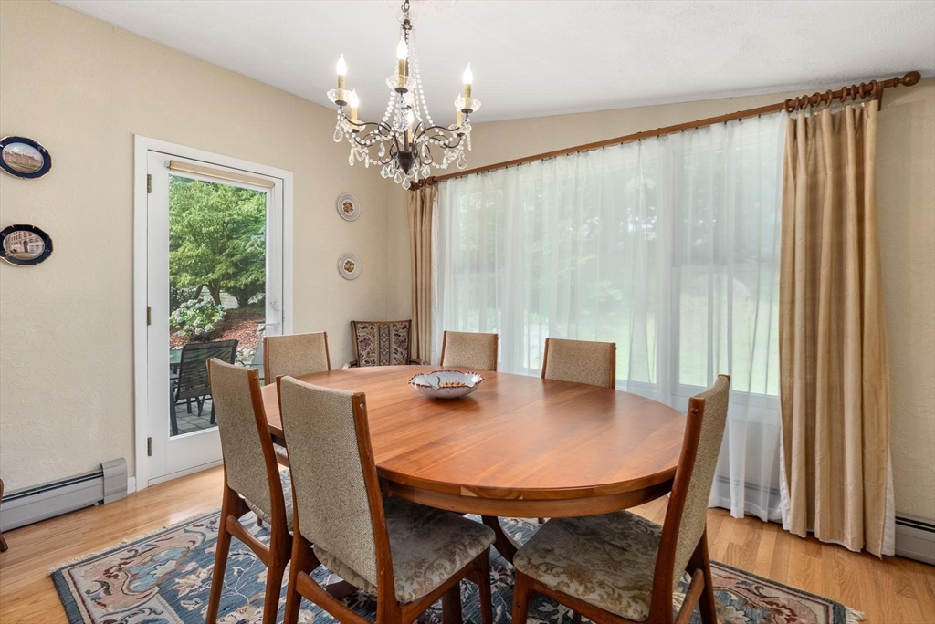 54 Clark Street Newton, MA 02459 - Photo 10 of 34 a view of a dining room with furniture window and wooden floor