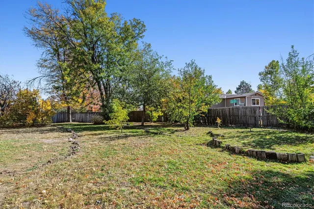 a backyard of a house with lots of green space