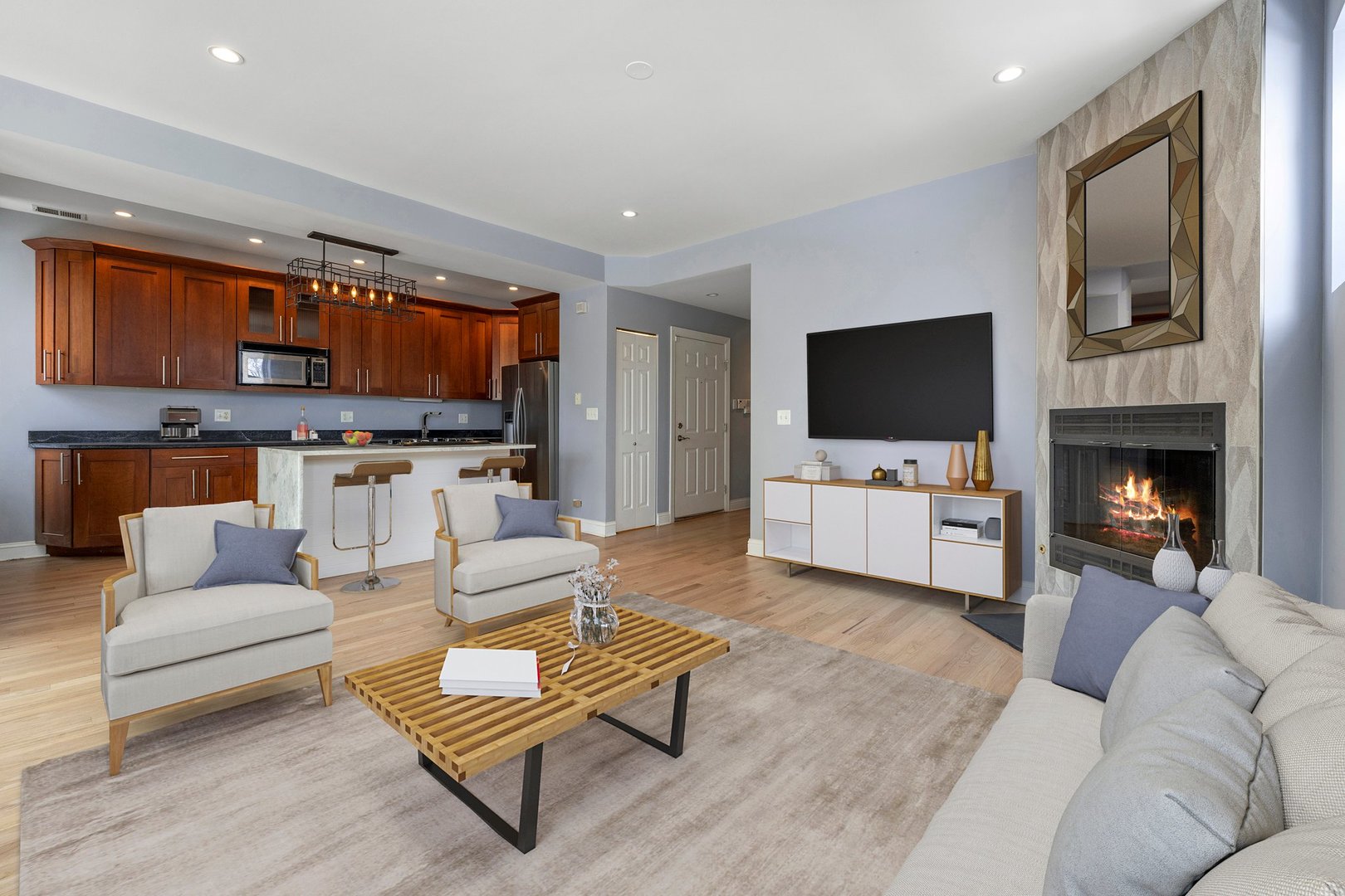 1122 North Oakley Boulevard, Unit C Chicago, IL 60622 - Photo 3 of 23 a living room with furniture and a flat screen tv