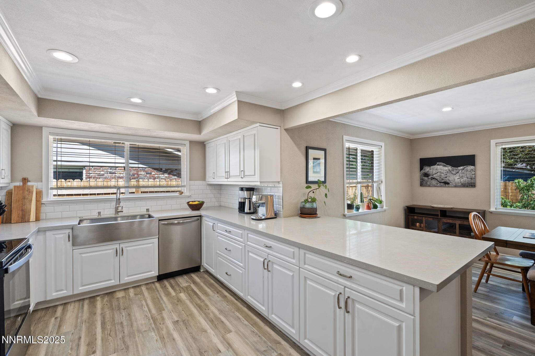 1445 California Avenue Reno, NV 89509 - Photo 13 of 29 a kitchen with stainless steel appliances granite countertop a sink and cabinets