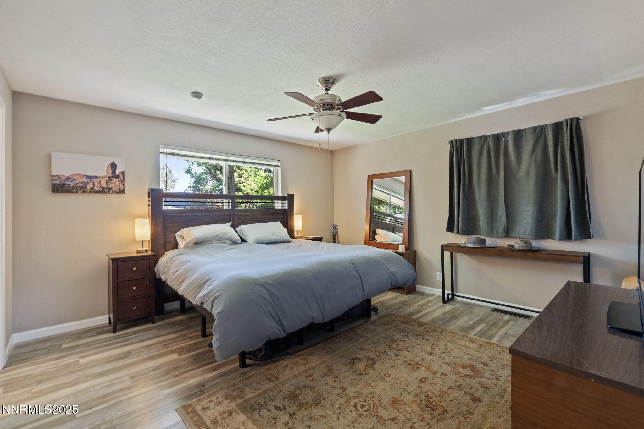 1445 California Avenue Reno, NV 89509 - Photo 17 of 29 a bedroom with a large bed and a window