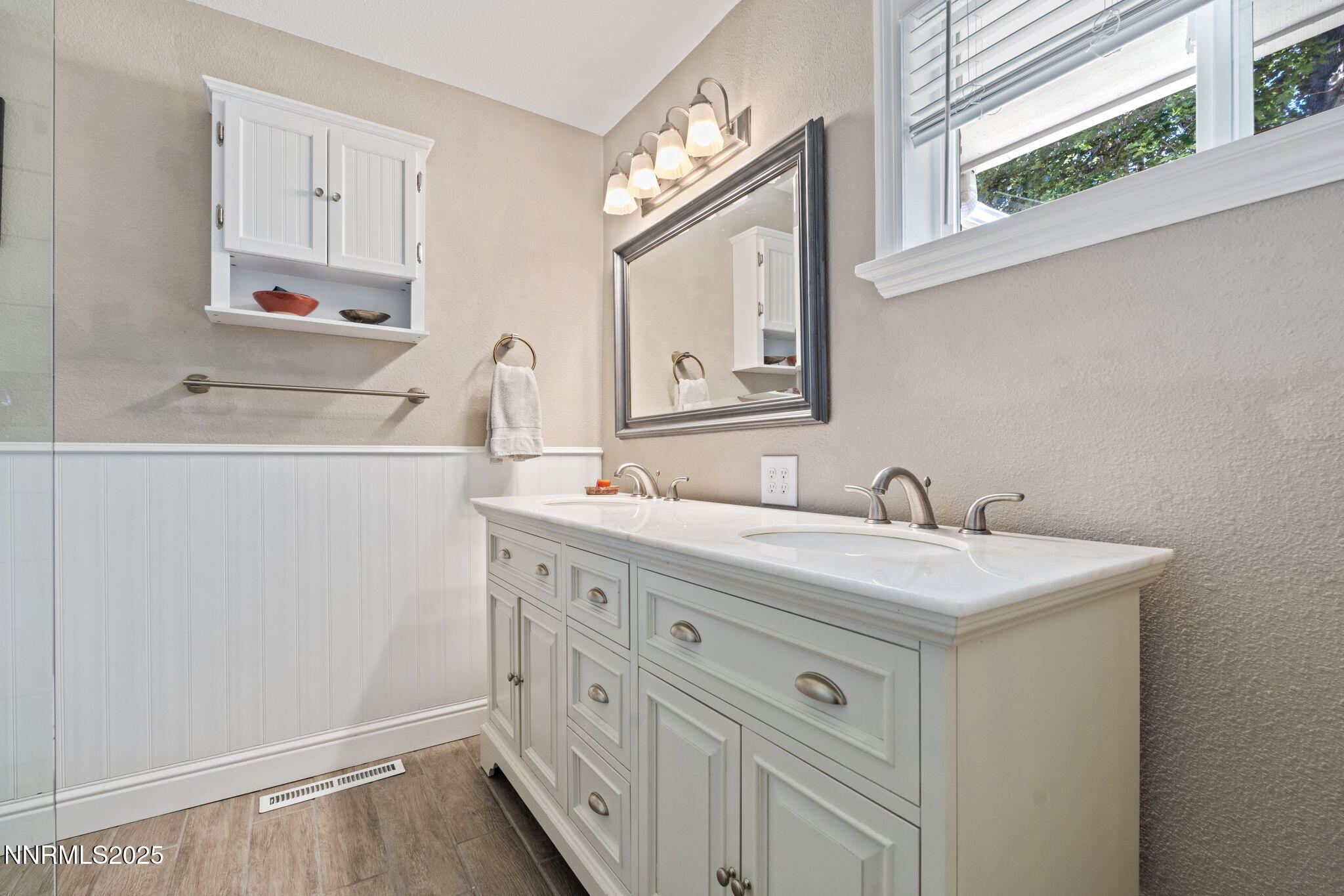 1445 California Avenue Reno, NV 89509 - Photo 18 of 29 a bathroom with a sink vanity and mirror