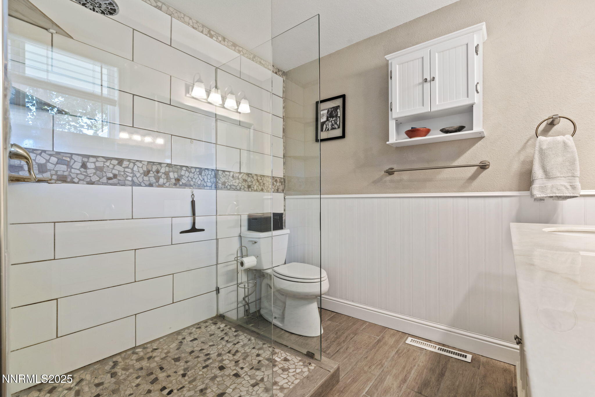 1445 California Avenue Reno, NV 89509 - Photo 19 of 29 a bathroom with a sink a toilet and shower