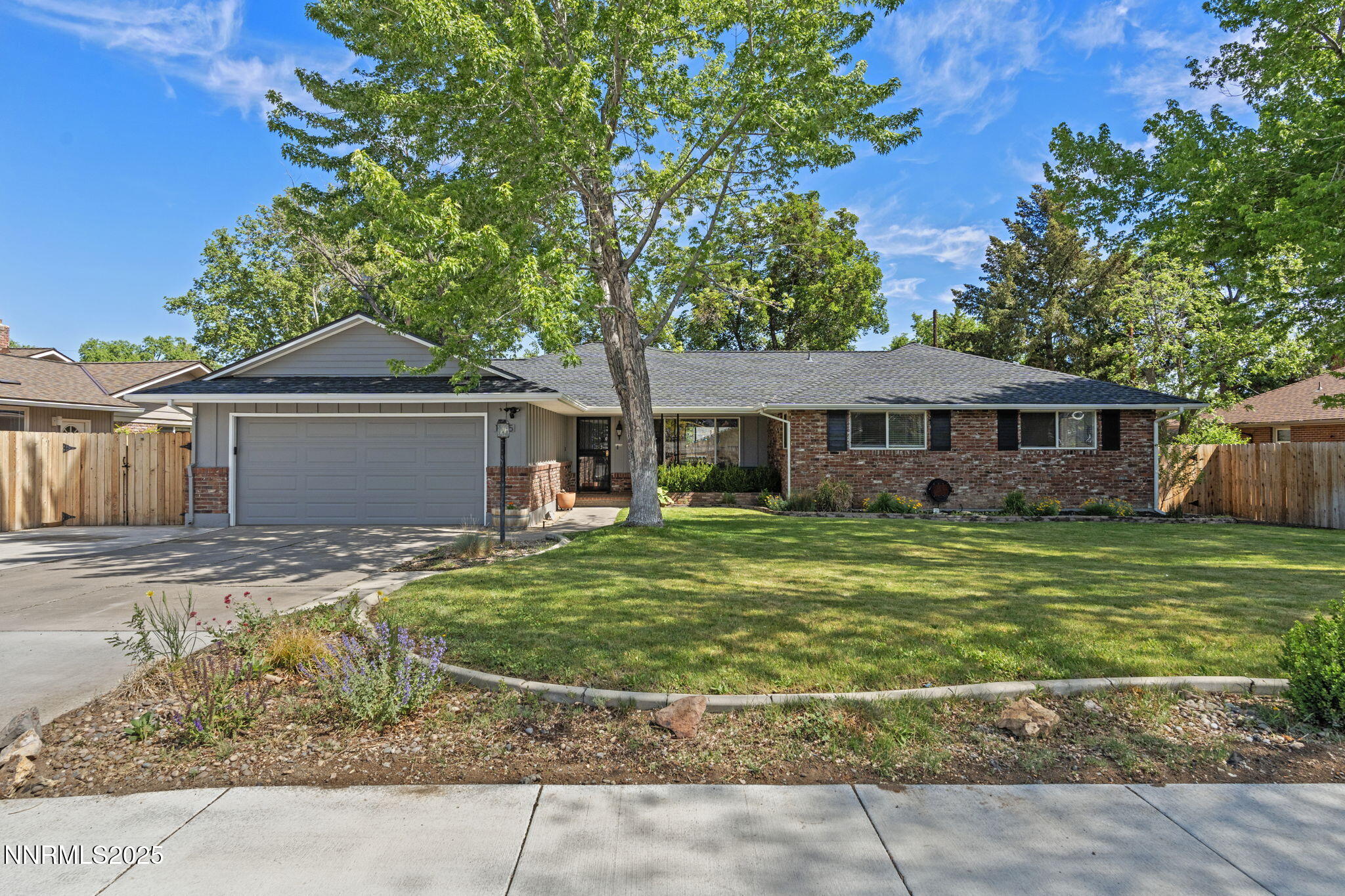 1445 California Avenue Reno, NV 89509 - Photo 2 of 29 a front view of a house with a garden