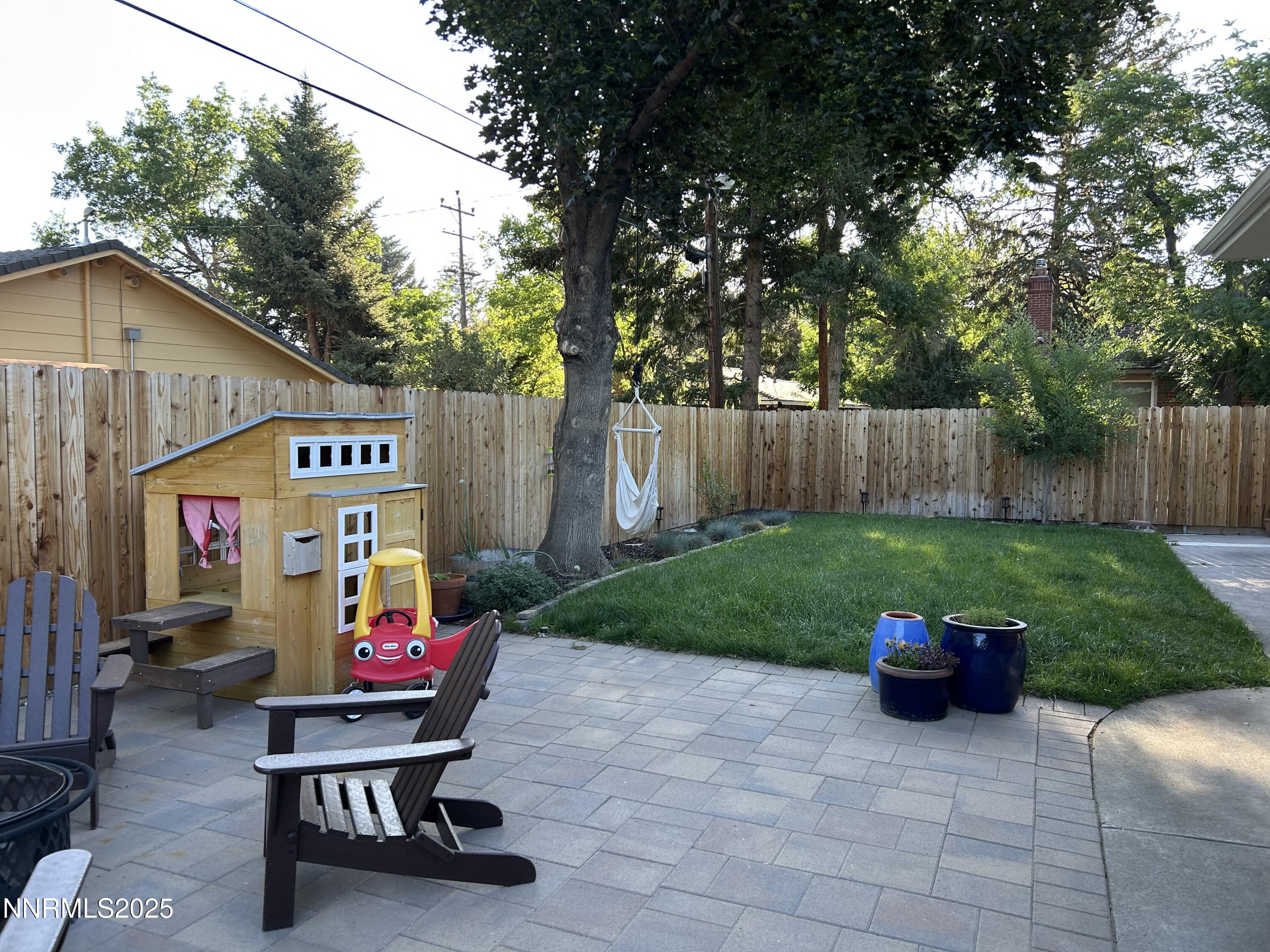 1445 California Avenue Reno, NV 89509 - Photo 23 of 29 a view of a chairs and tables in the back yard of the house
