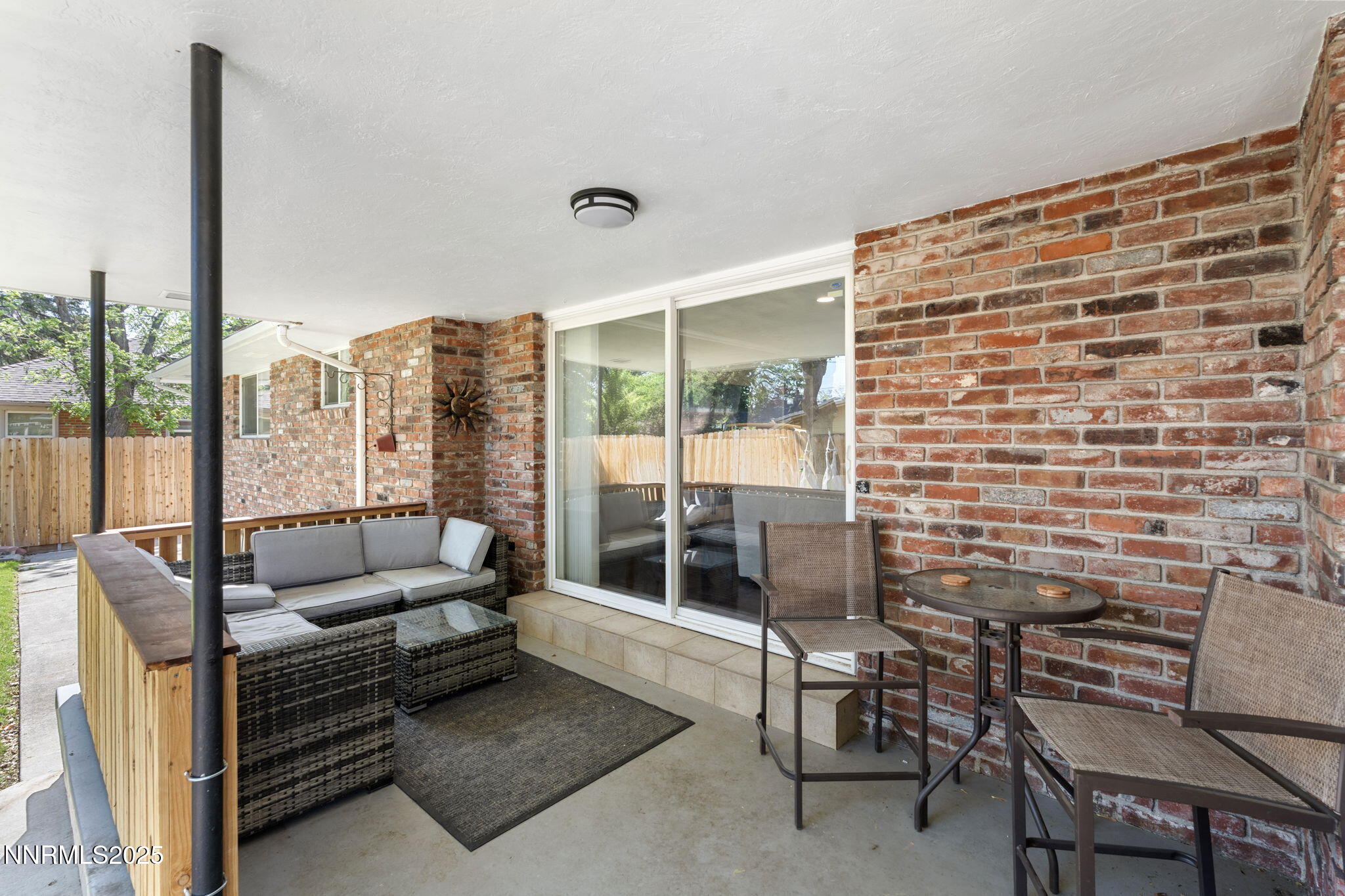 1445 California Avenue Reno, NV 89509 - Photo 25 of 29 a balcony with furniture and a potted plant