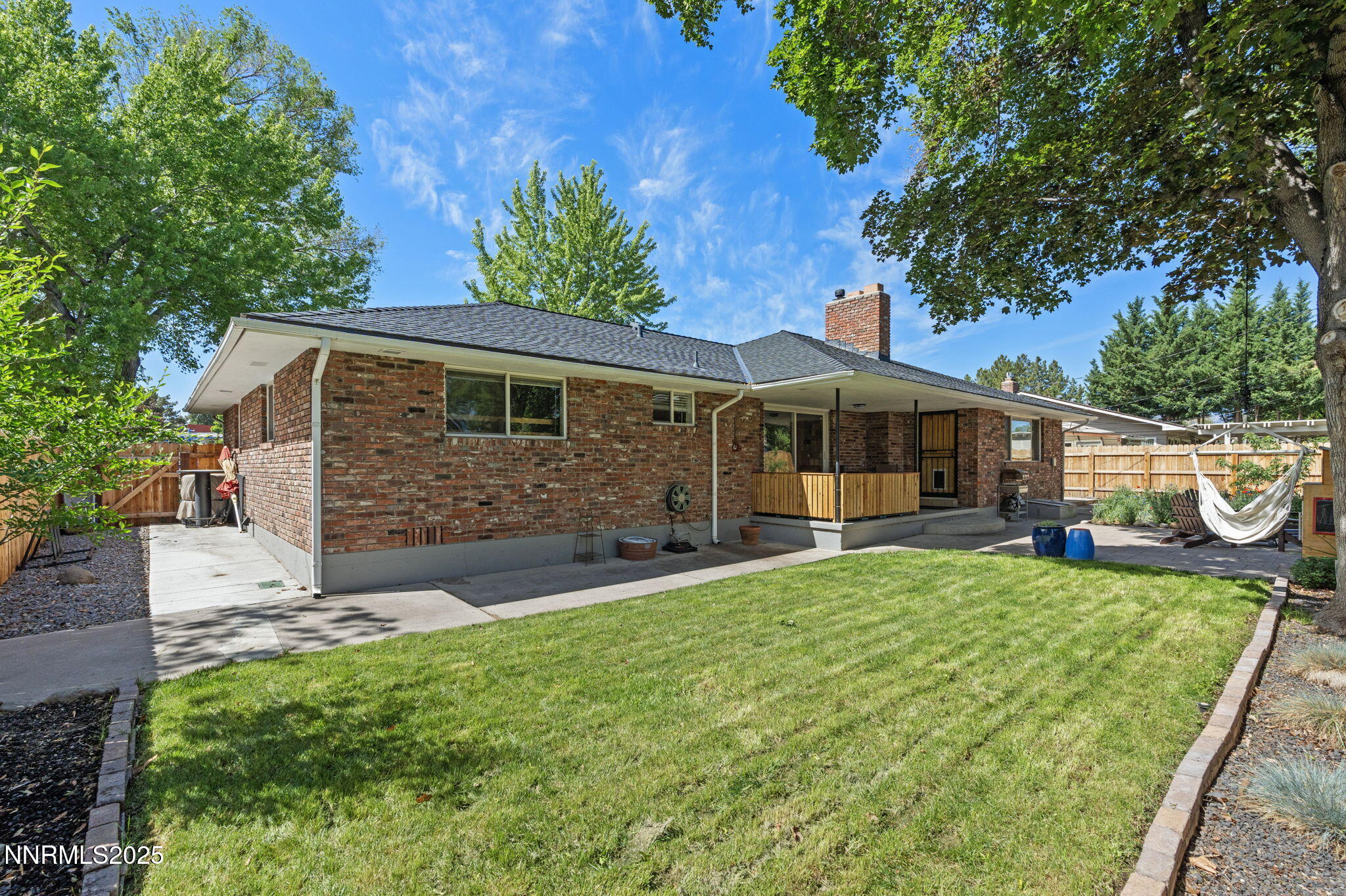 1445 California Avenue Reno, NV 89509 - Photo 26 of 29 a view of a house with backyard porch and garden