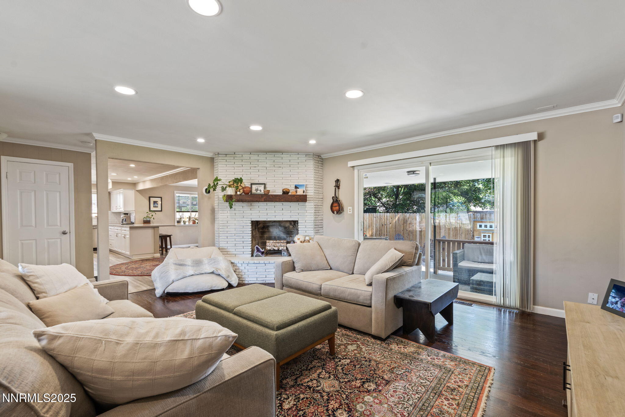 1445 California Avenue Reno, NV 89509 - Photo 6 of 29 a living room with furniture fireplace and a table