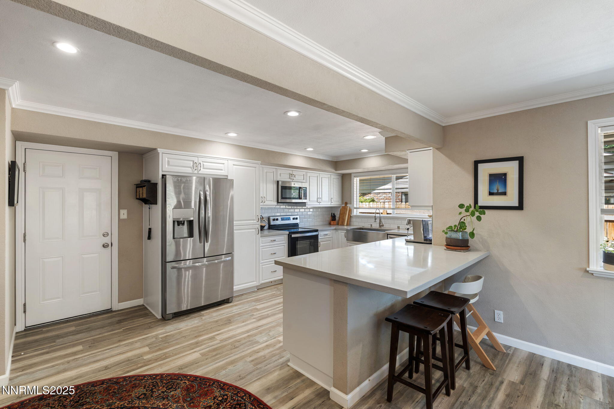 1445 California Avenue Reno, NV 89509 - Photo 10 of 29 a kitchen with refrigerator and windows