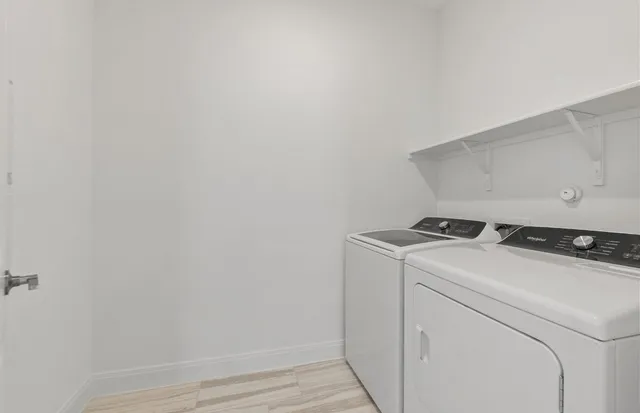 a bathroom with a sink toilet and a mirror