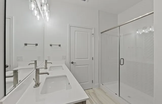 a bathroom with a toilet a sink a mirror and vanity