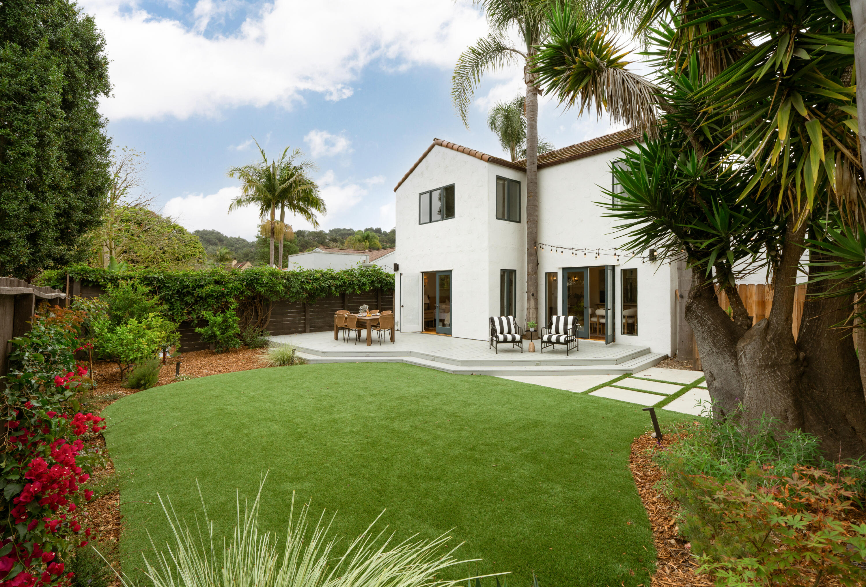 a view of house with outdoor space and swimming pool