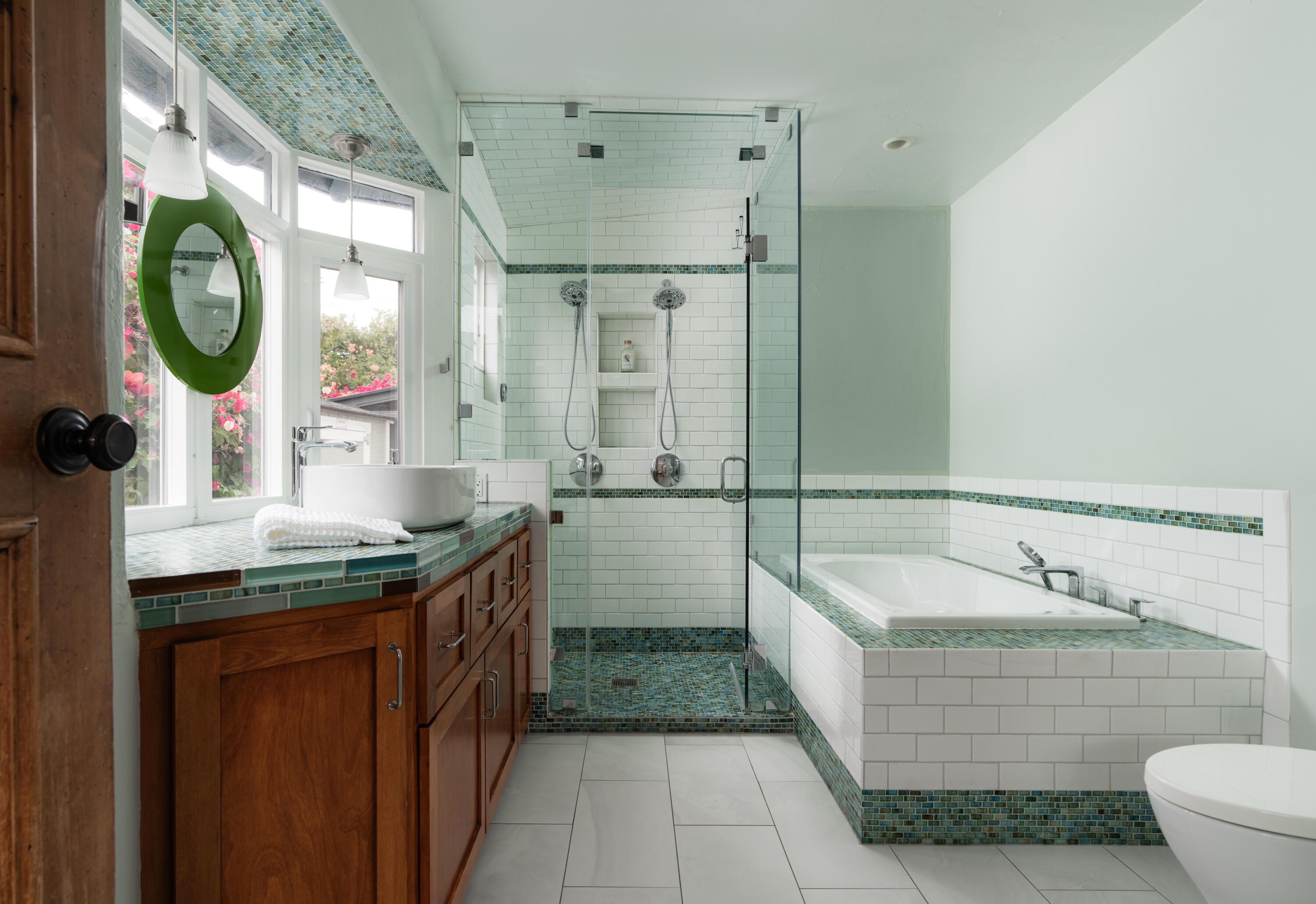 1740 Clearview Road Santa Barbara, CA 93101 - Photo 15 of 21 a bathroom with a granite countertop sink a mirror a bathtub and shower