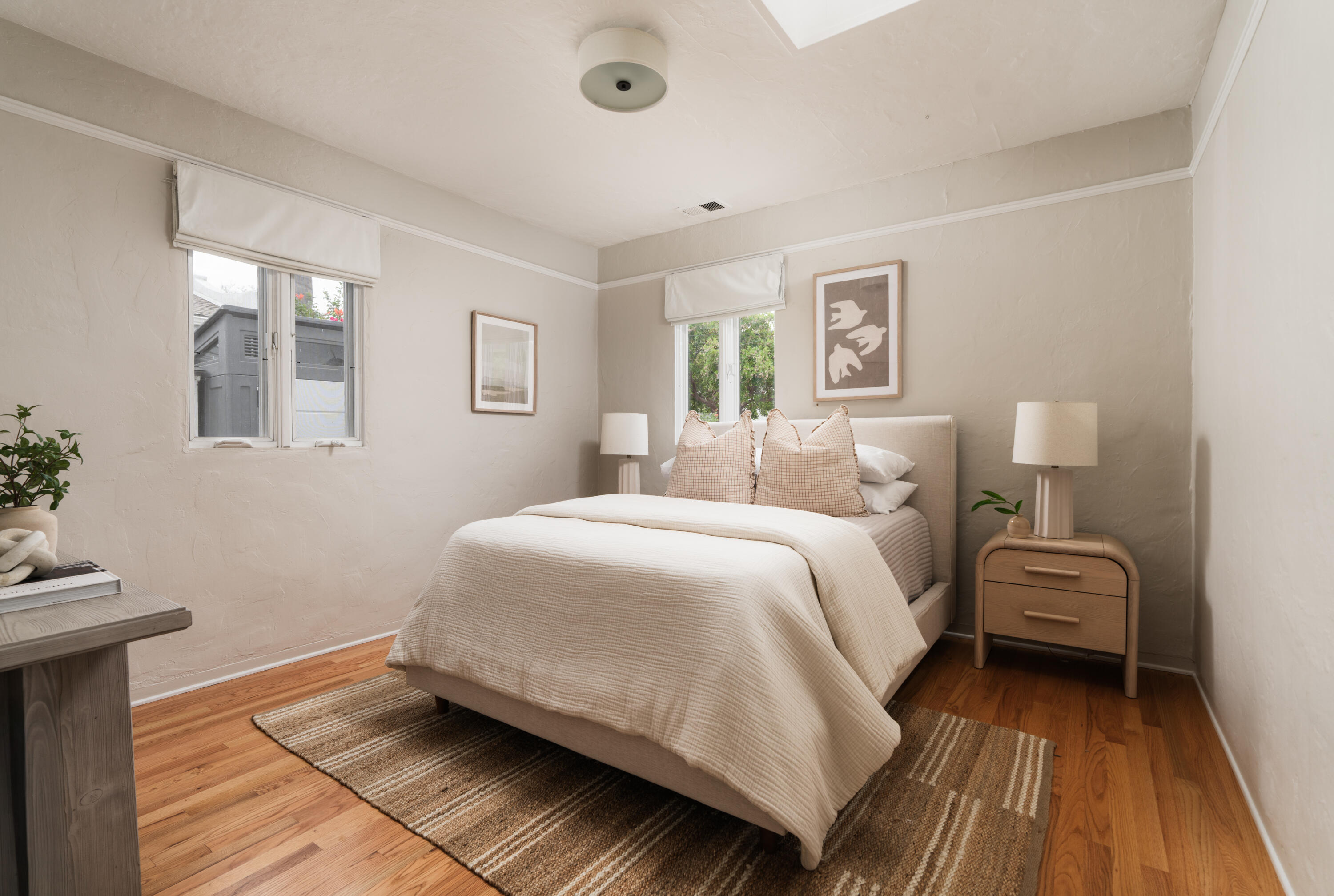 1740 Clearview Road Santa Barbara, CA 93101 - Photo 16 of 21 a bedroom with a bed and wooden floor